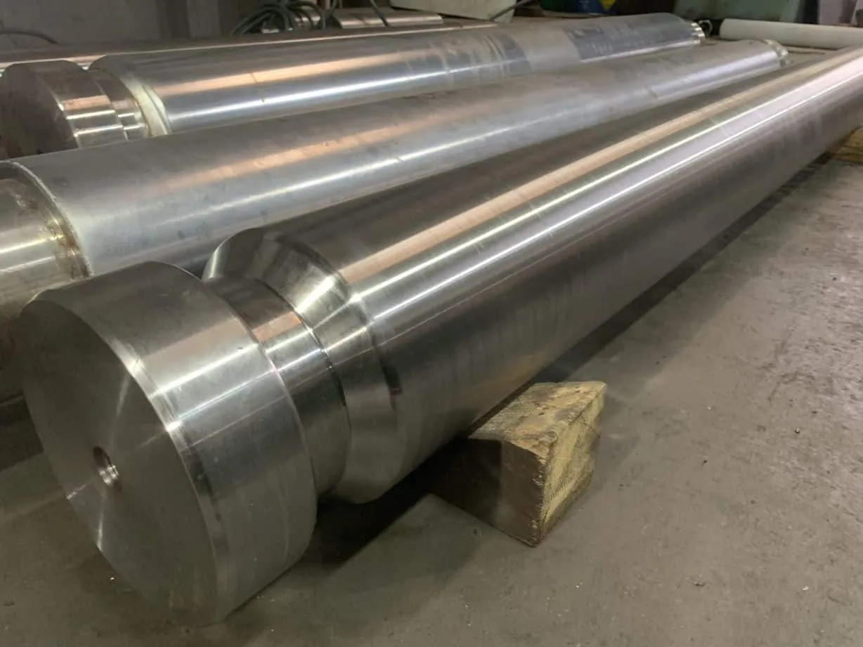 Large turned roll shafts with machined shoulders